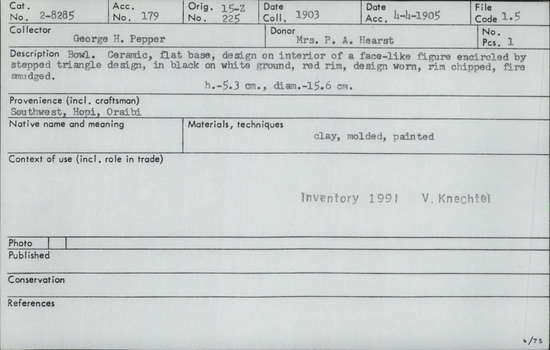 Documentation associated with Hearst Museum object titled Bowl, accession number 2-8285, described as Bowl. Ceramic, flat base, design on interior of a face-like figure encircled by stepped triangle design, in black on white ground, red rim, design worm, rim chipped, fire smudged. Clay, molded, painted. Height 5.3 cm.; diameter 15.6 cm.