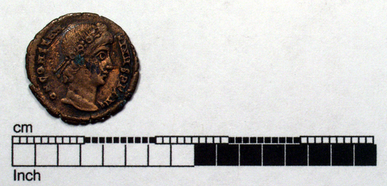 Hearst Museum object titled Coin: æ, accession number 8-8583, described as Coin; bronze; obverse: head of Constantine I; reverse: standards between soldiers