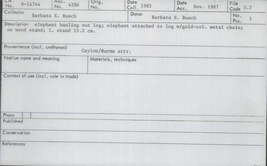 Documentation associated with Hearst Museum object titled Figurine, accession number 9-14744, described as elephant hauling out log; elephant attached to log w/gold-col. metal chain; on wood atand;  L. stand 15.2 cm.