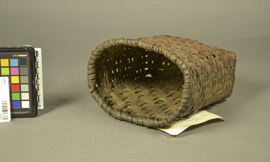 Hearst Museum object titled Basket, itaya, accession number 9-22970, described as A woven basket of maple splints, often harvested and used when green. The small size of the basket indicates that it was worn at the waist.