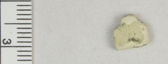 Hearst Museum object titled Fragment, accession number 5-13186, described as Fragment, heavily eroded, cross-shaped with checkered design, 1 cm square.