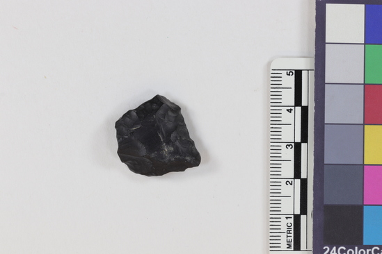 Hearst Museum object 2 of 2 titled Flake, accession number 16-14412, described as Projectile point fragment; obsidian; triangular; weight: 2.41 grams; length: 2.11 cm; width: 2.25 cm; depth: 0.75 cm.