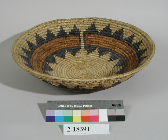 Hearst Museum object titled Basket, accession number 2-18391, described as Round, flat base, flaring sides, design of a red band with two bands of stepped design in black, on natural ground. Coiled, herringbone rim.