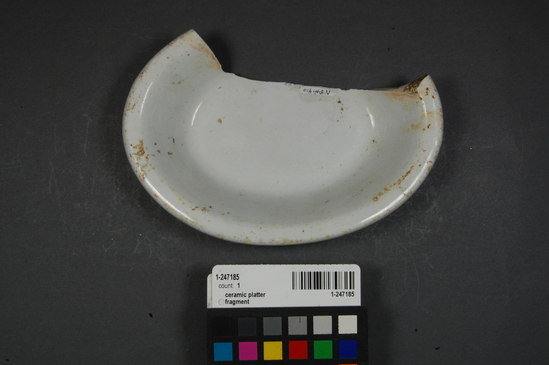 Hearst Museum object 2 of 2 titled Ceramic platter fragment, accession number 1-247185, described as Ceramic platter; base rim refined white earthenware; stamp (trademark) embossed lettering