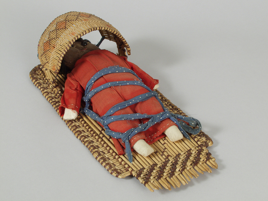 Hearst Museum object 3 of 4 titled Cradle basket and doll, accession number 1-211613a,b, described as (a) Basketry cradle. (b) Rag baby doll.