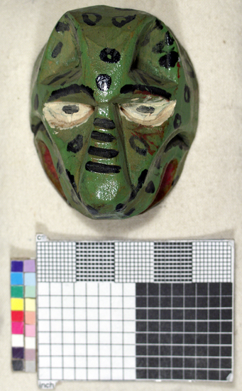 Hearst Museum object titled Toy mask, accession number 3-15588, described as Carved wooden toy mask; painted green face