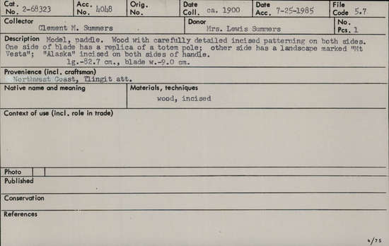 Documentation associated with Hearst Museum object titled Paddle, accession number 2-68323, described as Wood with carefully detailed incised patterning on both sides. One side of blade has a replica of a totem pole; other side has a landscape marked "Mt Vesta"; "Alaska" incised on both sides of handle.