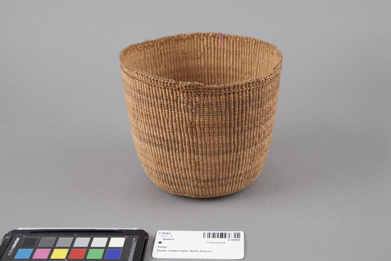 Hearst Museum object 3 of 3 titled Basket, accession number 2-34265, described as Cylindrical, twined spruce root, faded red and blue dyed bands; split spruce root false embroidery: brown band near rim, and yellow and purple bands on base. Slightly damaged.