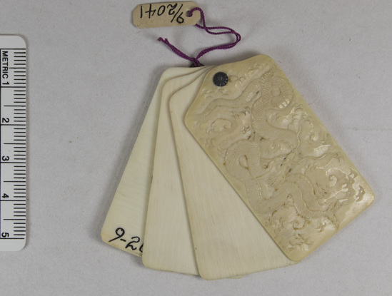 Hearst Museum object titled Netsuke, accession number 9-2041, described as Hand carved ivory note pad, dragon design. (duplicate) (miniature)