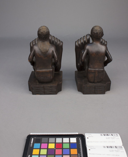 Hearst Museum object 7 of 8 titled Wood figurine, accession number 10-3141a,b, described as Bookends, wooden, male and female figures, 27 centimeters by 10 centimeters