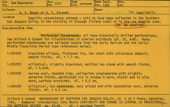 Documentation associated with Hearst Museum object titled Charmstone, accession number 1-255204, described as Perforated Charmstone; Narrow oval, rounded tips, yellow/tan conglomerate with slightly abrasive finish, perforated tip is broken & worn, distal end is also worn, surface scratched