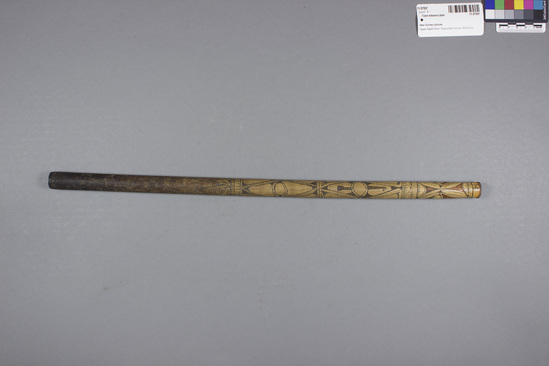 Hearst Museum object 2 of 2 titled Cane tobacco pipe, accession number 11-37557, described as Tobacco pipe, cane, with incised designs filled with black pigment, 48.3 cm long. Used for smoking.