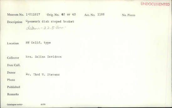 Documentation associated with Hearst Museum object titled Basket, accession number 1-211517, described as Openwork dish-shaped basket.  Tag "NW Calif".  Second tag "Klamath R. Tribes Att.". Per Ralph Shanks:  Twined openwork basket. The basket has a crossed warp starting knot.  The warp and weft material is hazel or willow.  At the start there is some reddish plant material.  The basket is plain twined over primarily one warp, with the rows spaced approximately .5 inch apart. The rim is trimmed.  The basket has an up to the right slant of weft twist and a rightward work direction.  The workface is on the exterior.  The basket is from Northwestern California.