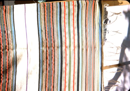 Hearst Museum object titled Color slide, accession number 25-18633, described as Sarape, white with polychrome stripes