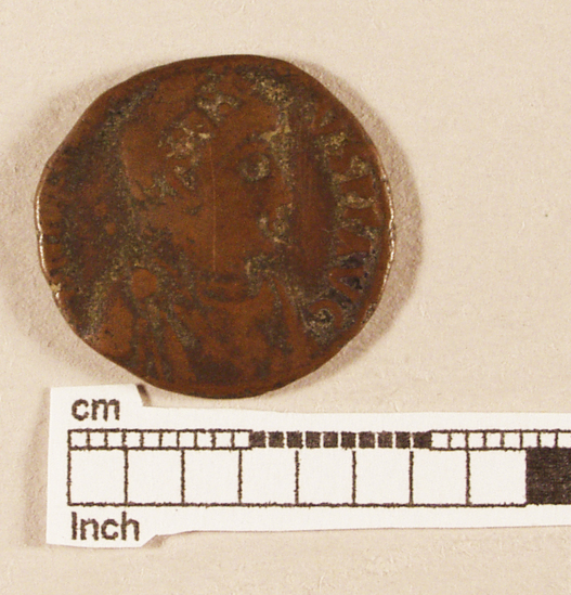 Hearst Museum object titled Coin: æ follis, accession number 8-7334, described as Coin, AES Follis           3.94 grams. 20mm. Obverse: Constantius II Reverse: Figure with standard GLORIA (Obscure)