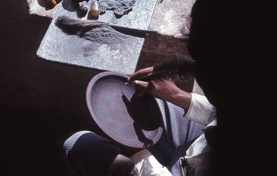 Hearst Museum object titled Color slide, accession number 25-17225, described as Person drawing on pan with quill