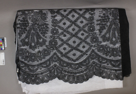 Hearst Museum object 2 of 3 titled Shawl, accession number 3-11063, described as Black lace shawl, floral patterned.