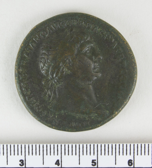 Hearst Museum object 11 of 12 titled Coin: æ sestertius, accession number 8-5518, described as Coin; AE; Sestertius; Roman. 26.65 grams, 33 mm. Trajan, 103-111 AD. Obverse: IMP CAES NERVAE TRAIANO AVG GER DAC PM TRP COS V(?) PP(?), head of Trajan r. laureate. Reverse: S.P.Q.R. OPTIMO PRINCIPI, Trajan mounted r. cuirassed and cloaked, lance aimed at barbarian r.; in exergue, S C