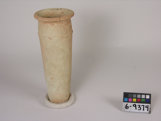 Hearst Museum object titled Broken jar, accession number 6-9374, described as Pottery: pinkish jar, cylindrical rim, broken, wavy line on shoulder, ld 10 cm, height 2 cm.