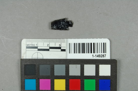 Hearst Museum object titled Point fragment, accession number 1-149287, described as Obsidian projectile, expanding stem, convex base, corner notched