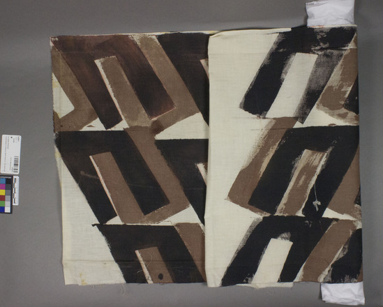 Hearst Museum object titled Textile, accession number 2-62811, described as Hand printed cotton cloth, black and brown on cream. Diagonal U shape, was once taped to mat board. “L. Allison” written on back. Student work. 1960s.