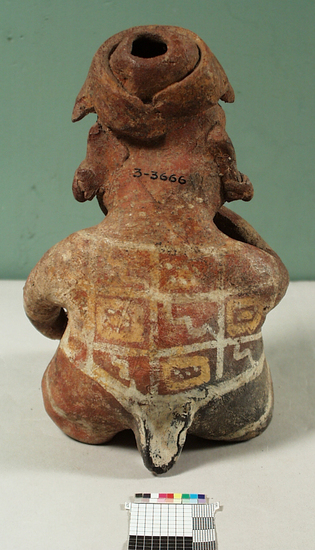 Hearst Museum object 2 of 2 titled Figurine, accession number 3-3666, described as Red pottery effigy of seated man with bowl between feet, snake crawling from bowl to mouth