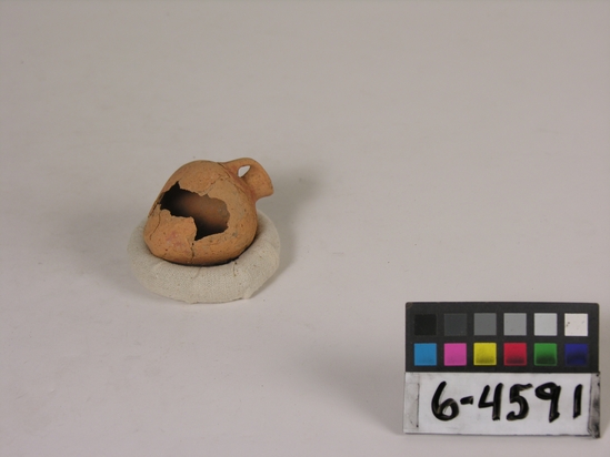 Hearst Museum object titled Model jug, accession number 6-4591, described as Pottery: thin pinkish model jug; hole in side; Predynastic