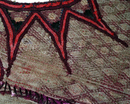 Hearst Museum object titled Huipil neckpiece, accession number 3-29642, described as Huipil neckpiece: Backstrap-loomed, warp predominant plain weave. Two-faced suppl. weft brocading. Three pieces joined back, front, and sides by randa. Head hole cut out and bound with embroidery; warps cut.