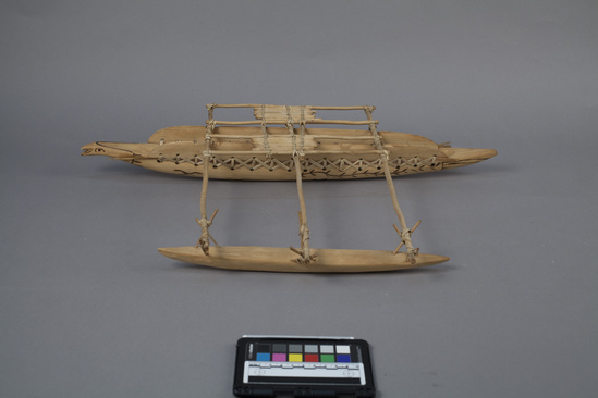 Hearst Museum object titled Model boat, accession number 11-3414, described as wood model of outrigger canoe with lateen sail