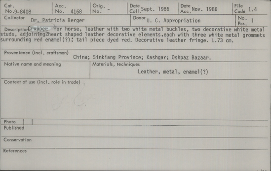 Documentation associated with Hearst Museum object titled Horse crupper, accession number 9-8408, described as Crupper for horse, leather with two white metal buckles, two decorative white metal studs, adjoining 2 heart shaped leather decorative elements, each with three white metal grommets surrounding red enamel (?); tail piece dyed red.  Decorative leather fringe.