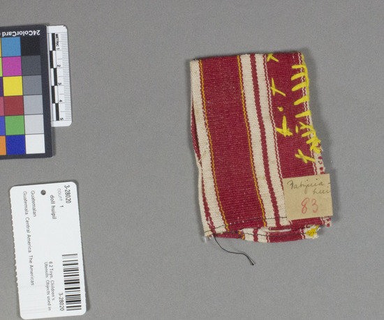 Hearst Museum object titled Doll huipil, accession number 3-28020, described as Doll’s huipil.  Cotton.  Basket weave, crudely embroidered.  Red, white, yellow stripes, yellow embroidery.  2 3/4 x 4 inches, doubled Location: Fatzicia