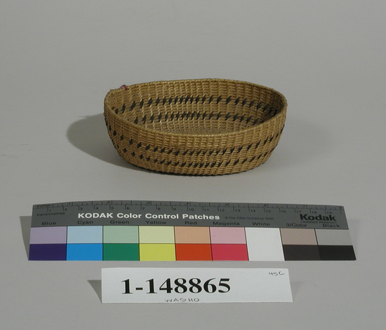 Hearst Museum object titled Basket, accession number 1-148865, described as Single rod coiled.  Double band design of bracken fern root.  Oval shape.