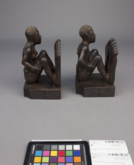 Hearst Museum object 8 of 8 titled Wood figurine, accession number 10-3141a,b, described as Bookends, wooden, male and female figures, 27 centimeters by 10 centimeters