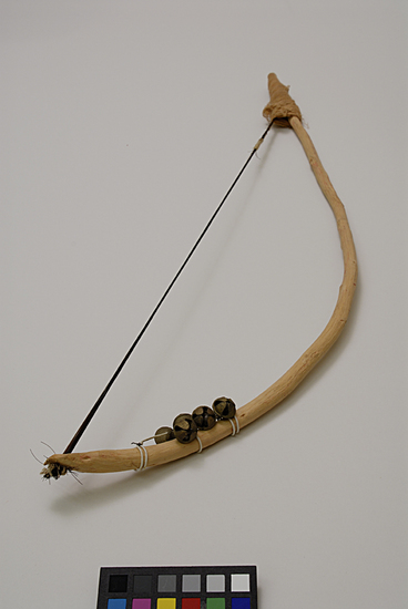 Hearst Museum object 2 of 4 titled Musical bow, accession number 9-10950, described as bow for stringed musical instrument; wood, horsehair, bells, cloth; Length 53 cm.