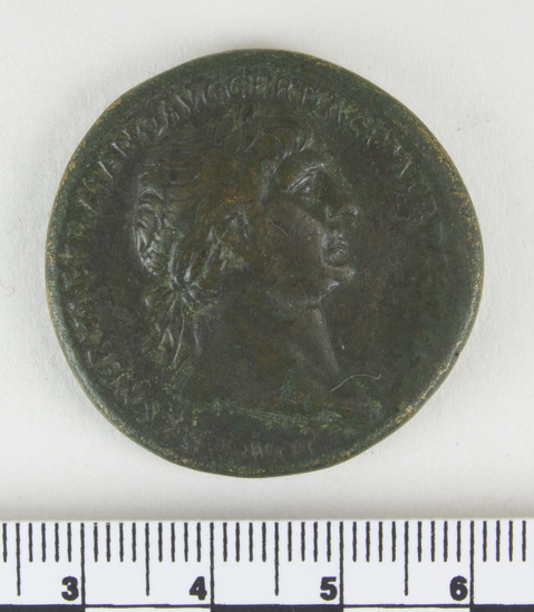 Hearst Museum object 5 of 12 titled Coin: æ sestertius, accession number 8-5518, described as Coin; AE; Sestertius; Roman. 26.65 grams, 33 mm. Trajan, 103-111 AD. Obverse: IMP CAES NERVAE TRAIANO AVG GER DAC PM TRP COS V(?) PP(?), head of Trajan r. laureate. Reverse: S.P.Q.R. OPTIMO PRINCIPI, Trajan mounted r. cuirassed and cloaked, lance aimed at barbarian r.; in exergue, S C