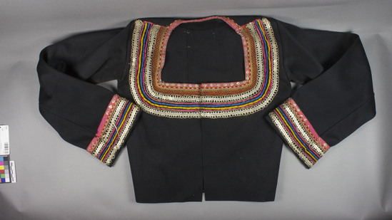 Hearst Museum object titled Jacket, accession number 7-3242, described as jacket; black wool felt w/varicolored trim; metal-wrapped yarns; metal discs, silk yarns, collar & cuffs velvet, metal embroidery; part of set 7-3241--3244. 18" long, 19" sleeve