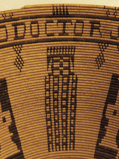 Hearst Museum object 7 of 27 titled Presentation basket, accession number 1-22478, described as Chumash coin-design presentation basket made by María Marta Zaputimeu, early 1800s. Three-rod juncus foundation is sewn with finely split sumac, black-dyed juncus, and a small amount of natural-orange juncus in the base design. The interior of the basket features the coat of arms of the Spanish kings repeated four times. This design was copied from a Spanish colonial coin known as the pillar dollar or piece of eight. The inscription reads "MARIA MARTA NEOFITA DE LA MISION DE EL SERAFICO DOCTOR SAN BVENAVENTVRA ME HIZO AN" (Maria Marta, neophyte of the mission of the Seraphic Doctor San Buenaventura made me [in the year]).  According to Timbrook (2014), "María Marta Zaputimeu (also spelled Saputimehue) was a Chumash woman born at the village of S'omɨs, namesake of the present-day town of Semis. She was baptized at nearby Mission San Buenaventura on June 5, 1788, at about twenty-one years of age (Mission San Buenaventura 1782-1808:No. 363). She had no children and died in 1830." According to Timbrook (2014), close inspection reveals "that fluffy white feathers were inserted horizontally into the foundation on the nonwork face, as the basket was being woven. These appear only on the exterior and are associated only with the four vertical pillarlike design elements that alternate with the shield figures." According to Timbrook, the incorporation of feathers was a stunning departure from Chumash tradition: "this use of feathers is more like that seen in Ohlone and Pomo examples.... and until now has been completely unknown in Chumash basketry."  Diameter: approximately 16¼ inches; height: 6½ inches. About 320 weft strands per inch. Notice: Image restricted due to its potentially sensitive nature. Contact Museum to request access.