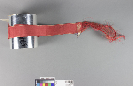 Hearst Museum object 2 of 3 titled Belt, accession number 11-210, described as Belt or ribbon of fiber, red.