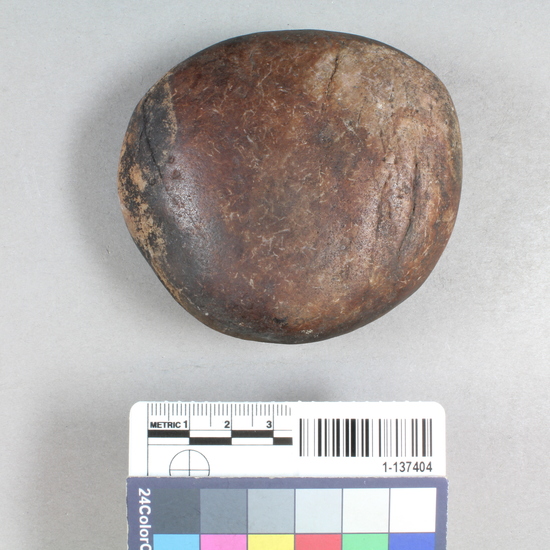 Hearst Museum object titled Sinker (fishing), accession number 1-137404, described as Pitted stone of quartzite