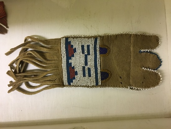 Hearst Museum object titled Pouch, accession number 2-5468, described as Buckskin; fringed; beaded geometric designs in blue, red, orange, and white.