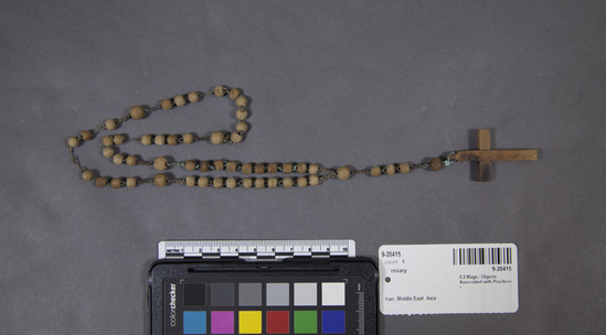 Hearst Museum object 2 of 3 titled Rosary, accession number 9-20415, described as Rosary necklace, wood, single strand on chain links; brown; crucifix pendant; length circa 35 centimeters.