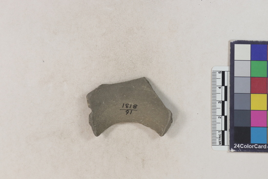 Hearst Museum object 2 of 2 titled Potsherd, accession number 16-8131, described as Potsherd; shoulder, incised and gouged design, drilled hole at one side. Numbers  8111 to 8194 are sherds picked up on beach at low tide.Section of Manta on beach currently inhabited.