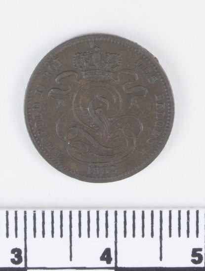Hearst Museum object titled Coin, accession number 7-6179, described as Belgium coin, copper, one centime, obverse seated lion, inscribed "L'UNION FAIT LA FORCE", below "1 CENT", reverse stylized "L" crowned, inscribed "LEOPOLD II ROI DES BELGES 1882", date 1869-1907.