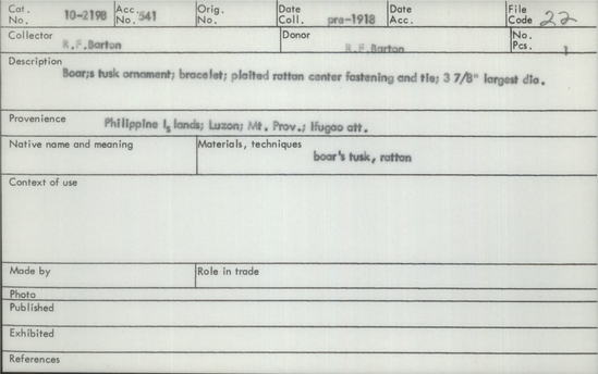 Documentation associated with Hearst Museum object titled Ornament, accession number 10-2198, described as Boar's tusk ornament; plaited rattan center fastening and tie; 3⅞ maximum diameter