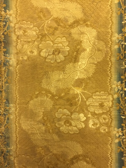 Hearst Museum object 33 of 49 titled Icon, accession number 7-3541, described as Icon of “Our lady of Vladmir”; Virgin and Child in tempera and gesso on wood; gilded silver basma; cloisonne halo with cloisonne collar pendant; halo has glass and amber (?) ornamentation; Virgin’s face damaged; height 30.2 cm, width 26 cm.