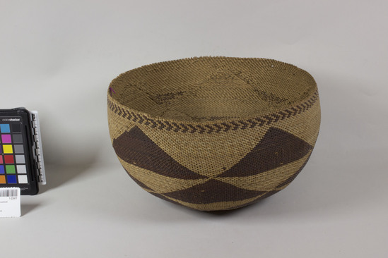 Hearst Museum object 2 of 2 titled Basket, accession number 1-22417, described as Small, round. Diagonal twine. Brown decoration.