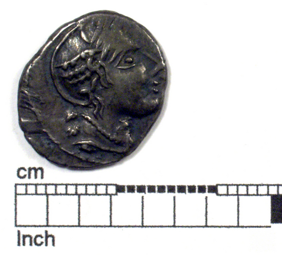 Hearst Museum object titled Coin: ar denarius, accession number 8-8024, described as Coin. Silver. Gallic imitation of Roman denarius. (1.91 grms.; 17 mm.) Obverse: Head of Roma facing right, wearing necklace; DVRNACOS. Reverse: Horseman riding facing right, holding spear; AVSCROCVS.