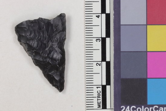 Hearst Museum object 1 of 2 titled Projectile point fragment, accession number 16-14235, described as Projectile point; obsidian; triangular; weight: 3.83 grams; length: 3.25 cm; width: 2.23 cm; depth: 0.6 cm; straight sides, broken base.