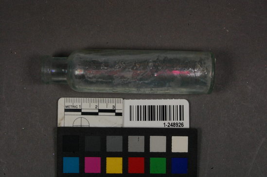 Hearst Museum object titled Bottle, accession number 1-248926, described as Glass bottle; whole; medicine; clear, stamp (trademark)