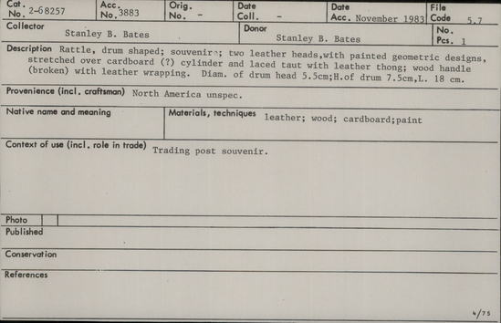 Documentation associated with Hearst Museum object titled Drum, accession number 2-68257, described as Rattle, drum shaped; souvenir; two leather heads, with painted geometric designs, stretched over cardboard (?) cylinder and laced taut with leather thong; wood handle (broken) with leather wrappings. Diameter of drum head 5.5 cm, height of drum 7.5 cm, length 18 cm. Trading post souvenir.